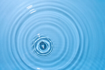 Naklejka na ściany i meble top view sky blue water rings, Close up water droplets, water surface
