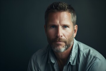 Obraz premium confident handsome healthy mature man, middle aged male model isolated on studio background advertising skin care concept. generative AI