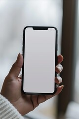 Mockup image of a woman holding modern smartphone with blank white screen in her hand