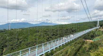 Fototapeta na wymiar Japan's longest pedestrian foot suspension bridge. Mishima Skywalk in Mishima City, Shizuoka Prefecture, Japan