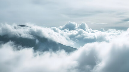 Misty Mountain Peaks Surrounded by Fluffy White Clouds