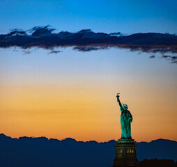 Statue of Liberty against dramatic orange twilight sky Beautiful!