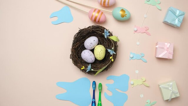 Dentist hands holding nest of colorful eggs on Easter day, top view.