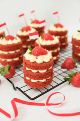 Mini red velvet cake with cream cheese and strawberry. Celebration of August 17, Indonesia's Independence Day. Selective focus.