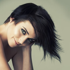 Hair, portrait and woman in studio with shampoo, treatment or haircut results on wall background....
