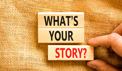 Storytelling and what is your story symbol. Concept words What is your story on blocks. Beautiful canvas background. Businessman hand. Business storytelling and what is your story concept. Copy space.