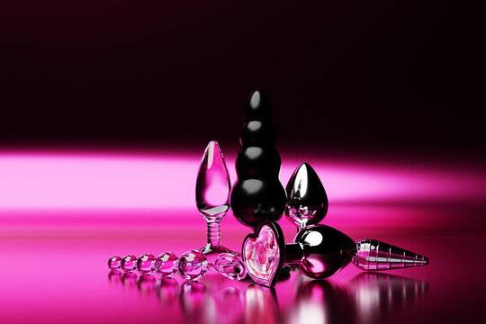 Colorful  butt anal plugs sex toys on  pink  isolated background. 3D illustration. Empty space for your text