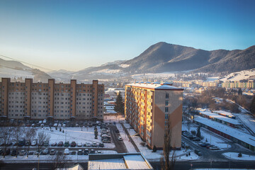 View of a town in winter season.Beautiful snowy mountains in background.