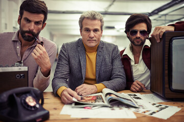 Group, men and meeting for fashion magazine company with retro planning in office. Vintage, style and colleagues planning journalist design and media production with publishing agency teamwork