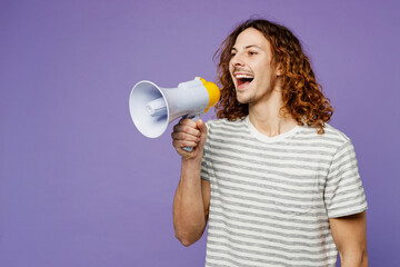 Young man wears grey striped t-shirt casual clothes hold in hand megaphone scream announces discounts sale Hurry up isolated on plain pastel light purple background studio portrait. Lifestyle concept.