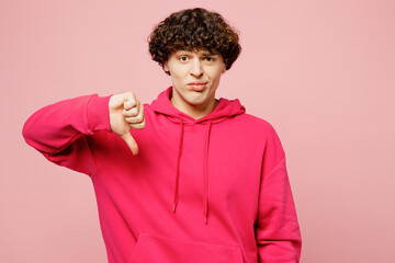 Young dissatisfied displeased sad disappointed Caucasian man he wears hoody casual clothes show...