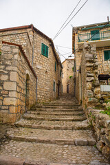 Fototapeta na wymiar A residential street in the historic coastal village of Sutivan, Brac Island, Croatia
