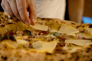 Experience street food by tasting freshly baked pizza made in Naples in multiple flavors and various types