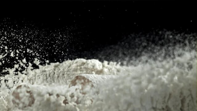 The rolling pin falls into the flour. Filmed on a high-speed camera at 1000 fps. High quality FullHD footage