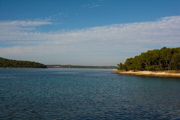 The coast of the Kasteja Forest Park - Park Suma Kasteja - in Medulin, Istria, Croatia. Premantura peninsula is on the left. December