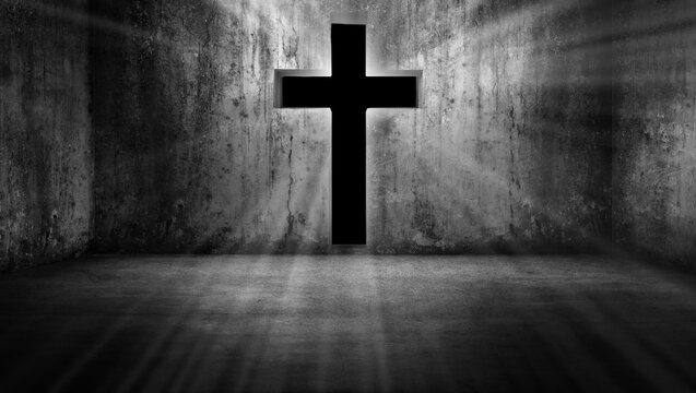 Black cross-shaped entrance with the figure of Jesus Christ glowing on a grunge background in a dark and dim empty room. The concept of in the darkness, light guides the way