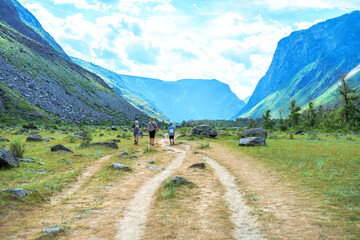 people hiking in the valley