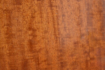 Unusual lacquered wooden background, lacquered furniture with dark and brown patterns, stains.