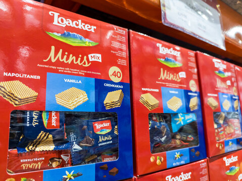 Close-up of Loacker Minis Mix wafers, featuring vanilla and chocolate flavors, displayed for sale on a supermarket shelf.