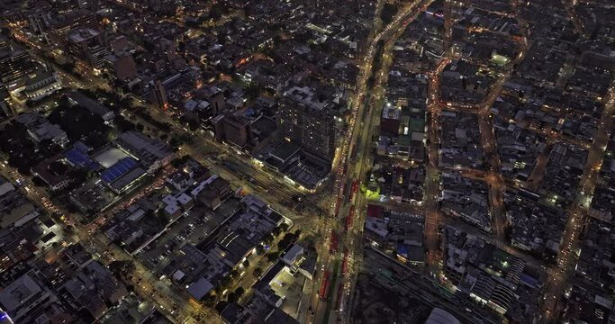 Bogota Colombia Aerial v24 flyover Avenida Caracas capturing busy traffics, illuminated cityscape across Quinta Camacho, Chapinero and Barrios Unidos at night - Shot with Mavic 3 Cine - November 2022