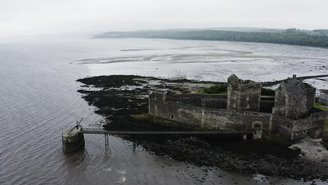 Drone shot of Blackness Castle surrounded by Scotland's waters.