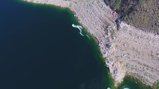 A high-flying drone shot over Lake Mead, a massive reservoir formed by the Hoover Dam on the Colorado River, that lies on the border of Arizona and Nevada, just east of Las Vegas.