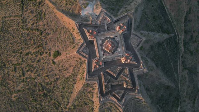 Drone footage over the Fortress of Nossa Senhora da Graca at sunrise in Elvas, Portugal