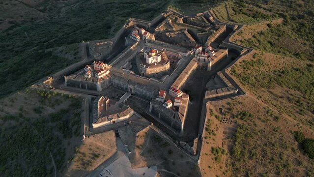Drone footage over the Fortress of Nossa Senhora da Graca at sunrise in Elvas, Portugal