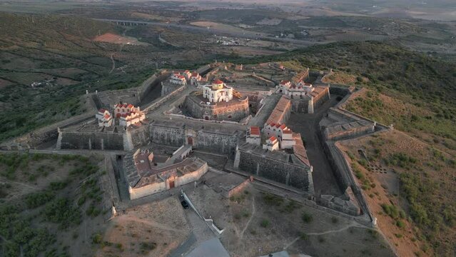 Drone footage over the Fortress of Nossa Senhora da Graca at sunrise in Elvas, Portugal