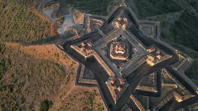 Drone footage over the Fortress of Nossa Senhora da Graca at sunrise in Elvas, Portugal
