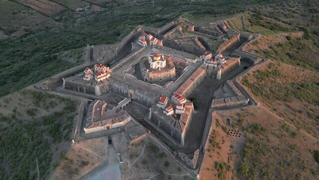 Drone footage over the Fortress of Nossa Senhora da Graca at sunrise in Elvas, Portugal