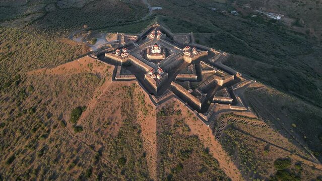 Drone footage over the Fortress of Nossa Senhora da Graca at sunrise in Elvas, Portugal