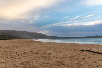 White waves hitting rocks on the ocean shore