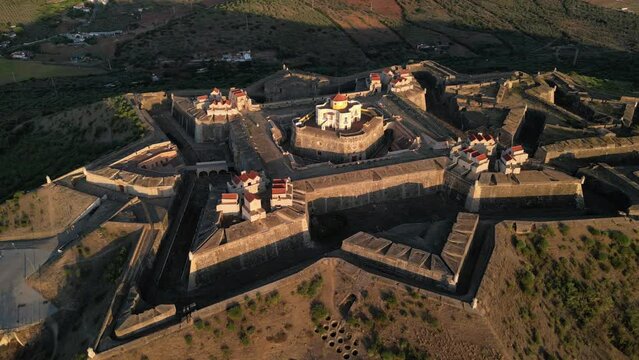 Drone footage over the Fortress of Nossa Senhora da Graca at sunrise in Elvas, Portugal