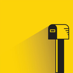 mailbox with shadow on yellow background