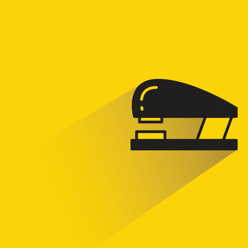 stapler icon with shadow on yellow background