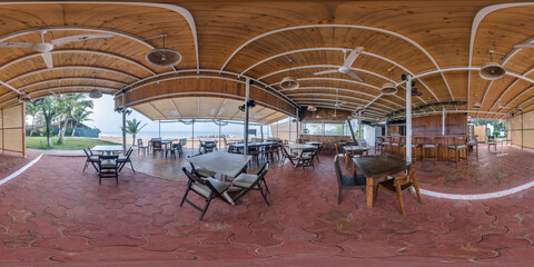 360 hdri panorama inside tropical shack or open air cafe on beach with coconut trees on ocean coast...