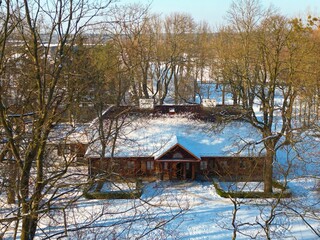 Winter scene over Radziejowice Park, featuring the beautiful palace in the village of Radziejowice near Warsaw, Poland.