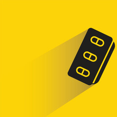 medicine tablet icon with shadow on yellow background
