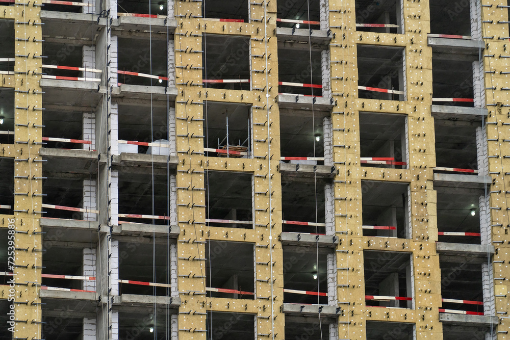 Poster this image captures the complex geometric patterns and raw textures of a building under construction
