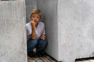 Curious Glance: A Young Boys Hide and Seek Moment in the City