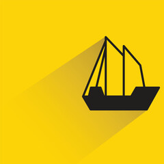 sailing ship with shadow on yellow background