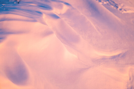 Close-up on a snow drift at sunset.