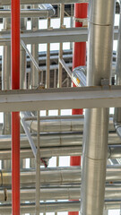 A detailed view of the pipes, distillation and refining system inside the building.