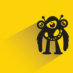 funny monster character with shadow on yellow background