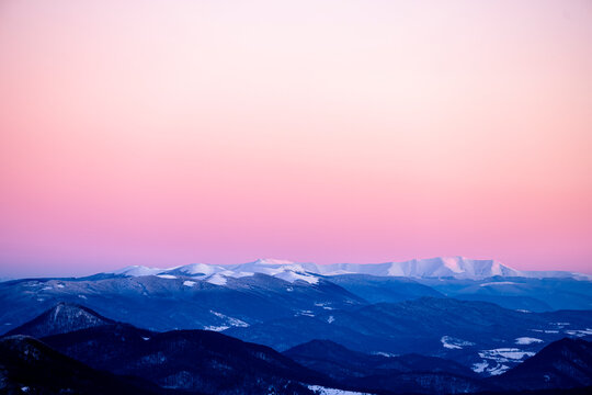 Winter landscape of the Bieszczady Mountains. A view on the Pikui mountain range and the Polonina Borshava in Ukraine from the Polonina Carynska, Poland.
