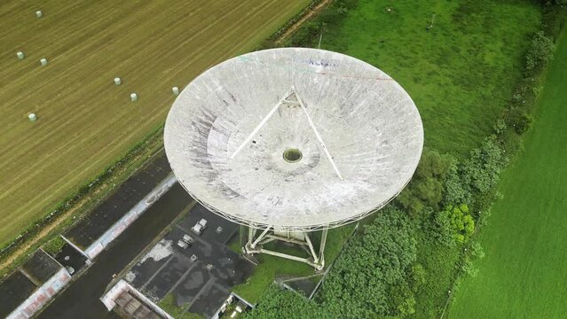 Drone fly over parabolic antenna radio station on cloudy day in Sao Miguel Island, Azores