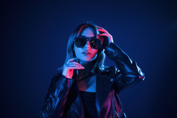 Cool young woman portrait in neon colors