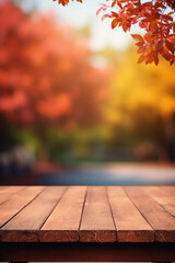 Empty blank wooden table fall background with autumn trees orange yellow color leaves backdrop forest or park nature scene abstract blurred bokeh tabletop for product display desk mockup. Copy space .