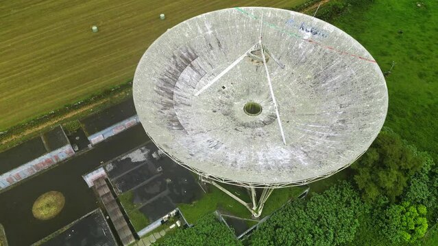 Drone fly over parabolic antenna radio station on cloudy day in Sao Miguel Island, Azores
